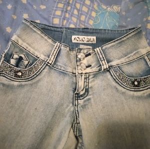 Blinged faded denim jeans